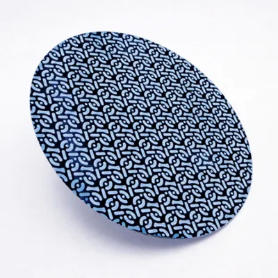 Consumible de diamante azul con patrón geométrico para el pulido de superficies en la preparación de muestras de metal